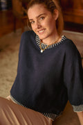 Pull maille coutures